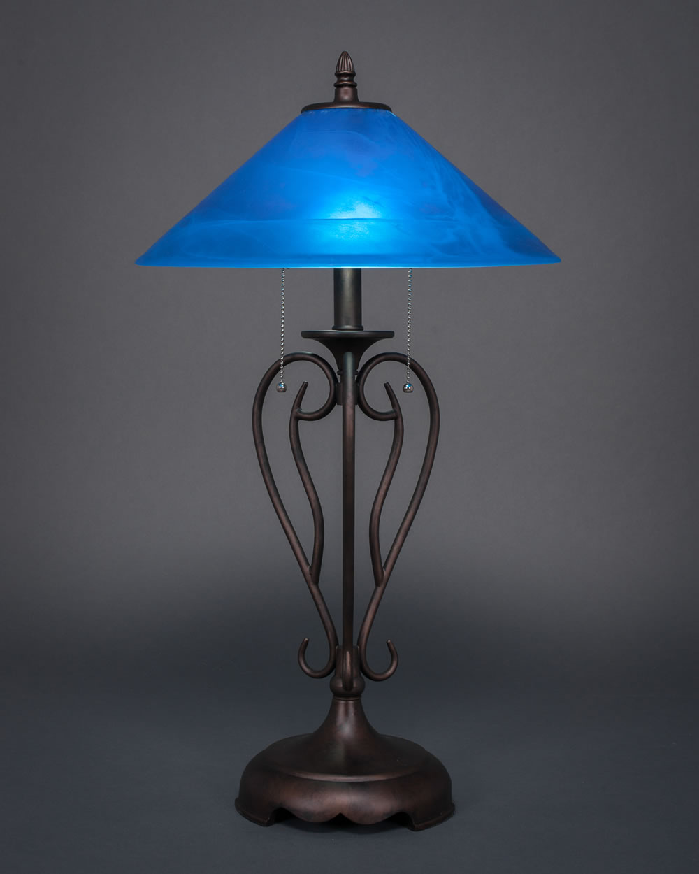 Olde Iron Table Lamp Shown In Bronze With 16" Blue Italian Glass