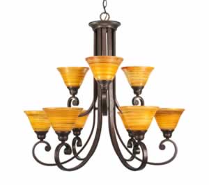 Curl 9 Light Chandelier Shown In Bronze Finish With 7" Firré Saturn Glass
