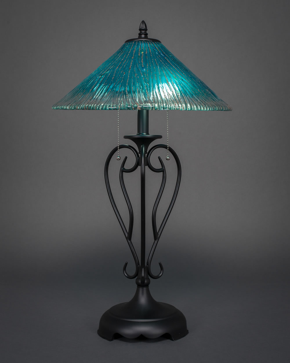 Olde Iron Table Lamp Shown In Matte Black Finish With 16" Teal Crystal Glass